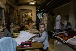 A girl draws at a table